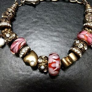 Gold tone pink bead charm bracelet up to 7.5"